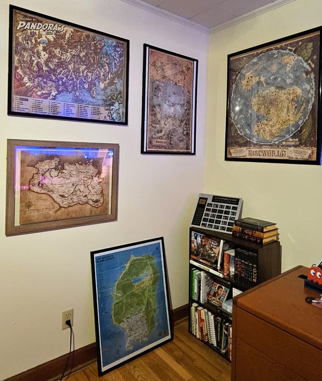 Turns out I really like maps for fictional places, so I started framing them. Getting others custom printed to expand the collection